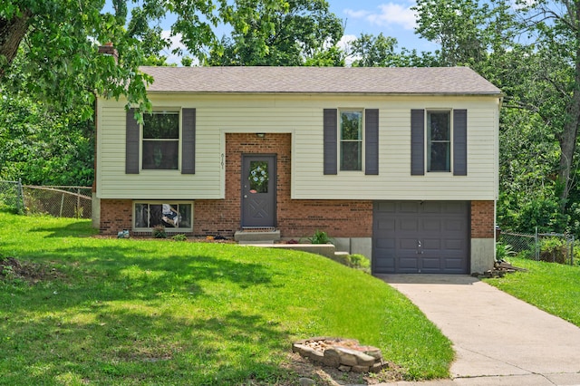 6161 Ridgewood Ct, Florence, KY 41042 - raised ranch with an attached garage, concrete driveway, and brick siding