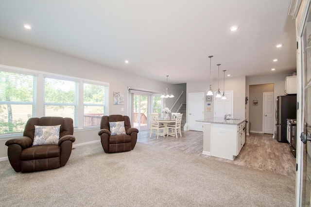 10056 Meadowvista Ct, Independence, KY 41051 - living area featuring light colored carpet, a chandelier, baseboards, and recessed lighting