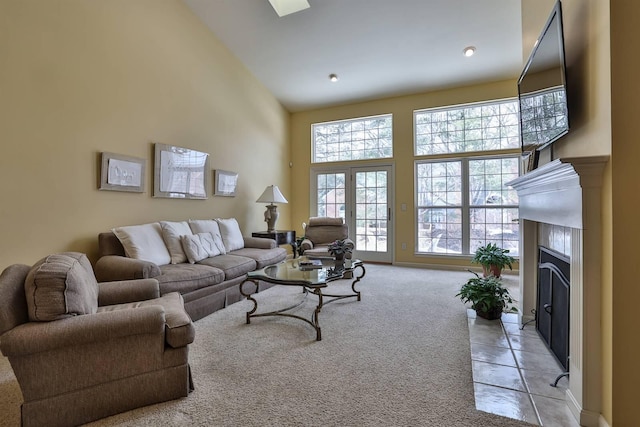 2754 Mansion Pl, Crestview Hills, KY 41017 - living area with high vaulted ceiling, light colored carpet, and a fireplace with flush hearth