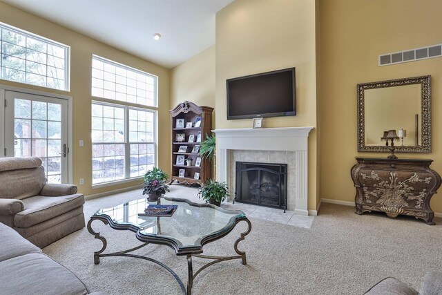 2754 Mansion Pl, Crestview Hills, KY 41017 - carpeted living area featuring a towering ceiling, a tile fireplace, and baseboards