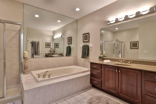2754 Mansion Pl, Crestview Hills, KY 41017 - bathroom featuring tile patterned flooring, a stall shower, a garden tub, vanity, and recessed lighting