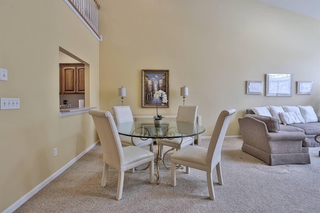 2754 Mansion Pl, Crestview Hills, KY 41017 - dining area with light carpet, baseboards, and a high ceiling