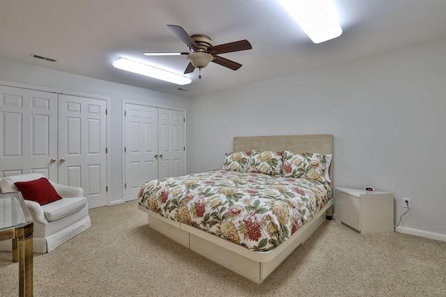 2754 Mansion Pl, Crestview Hills, KY 41017 - bedroom featuring light carpet, two closets, ceiling fan, and baseboards