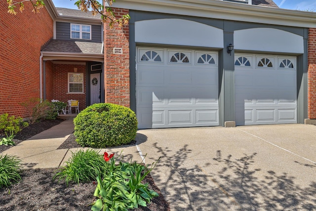 2754 Mansion Pl, Crestview Hills, KY 41017 - view of front of home featuring driveway, brick siding, and an attached garage