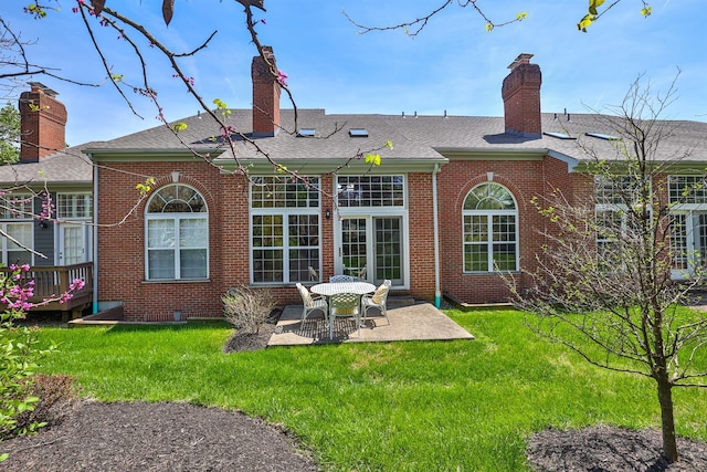 2754 Mansion Pl, Crestview Hills, KY 41017 - rear view of property featuring a patio, brick siding, a chimney, a yard, and roof with shingles