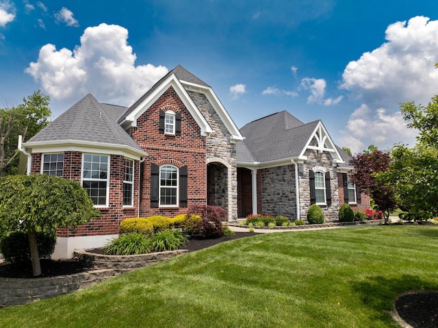 2563 Twin Hills Ct, Union, KY 41091 - view of front of property with a front yard, brick siding, stone siding, and roof with shingles