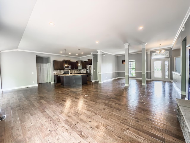 2563 Twin Hills Ct, Union, KY 41091 - unfurnished living room featuring decorative columns, ornamental molding, baseboards, dark wood-style flooring, and recessed lighting