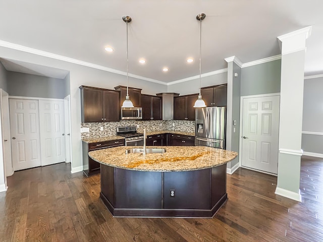 2563 Twin Hills Ct, Union, KY 41091 - kitchen with appliances with stainless steel finishes, a sink, dark brown cabinets, decorative backsplash, and a kitchen island with sink