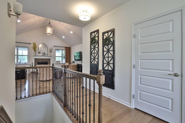 6520 Cannondale Dr, Burlington, KY 41005 - corridor featuring an upstairs landing, wood finished floors, vaulted ceiling, recessed lighting, and baseboards