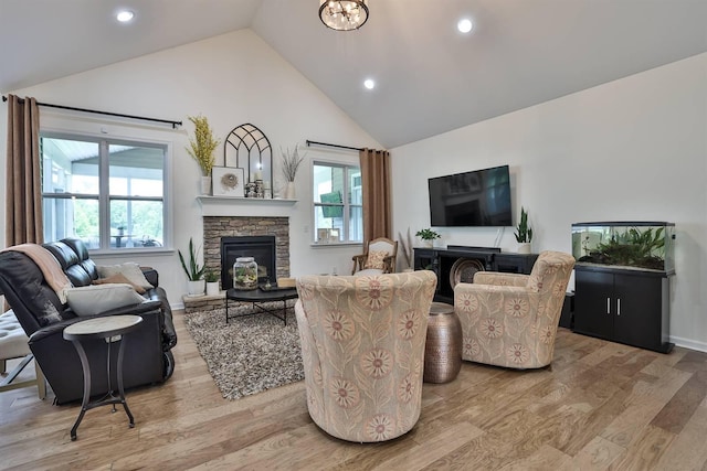 6520 Cannondale Dr, Burlington, KY 41005 - living area with a stone fireplace, light wood-type flooring, high vaulted ceiling, recessed lighting, and baseboards