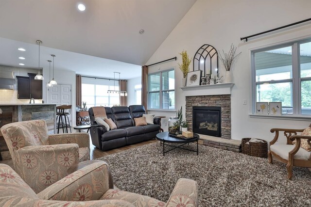 6520 Cannondale Dr, Burlington, KY 41005 - living area featuring wood finished floors, plenty of natural light, recessed lighting, a fireplace, and high vaulted ceiling
