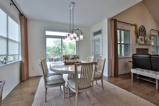 6520 Cannondale Dr, Burlington, KY 41005 - dining area featuring wood finished floors, a chandelier, and baseboards