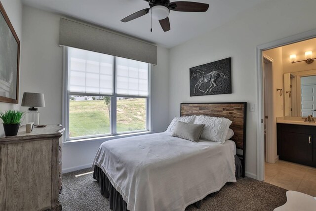 6520 Cannondale Dr, Burlington, KY 41005 - bedroom featuring a sink, baseboards, ensuite bath, light colored carpet, and ceiling fan