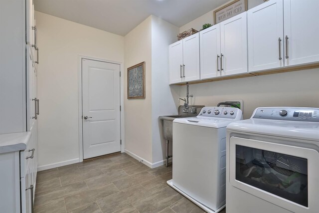 6520 Cannondale Dr, Burlington, KY 41005 - laundry room with separate washer and dryer, baseboards, and cabinet space