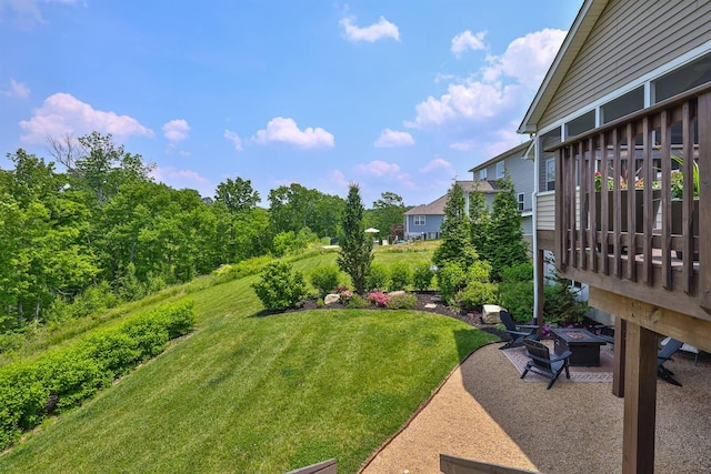 6520 Cannondale Dr, Burlington, KY 41005 - view of grassy yard featuring a fire pit, a wooden deck, and a patio area