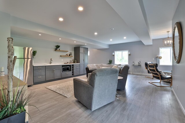 6520 Cannondale Dr, Burlington, KY 41005 - living area featuring wet bar, light wood-style flooring, baseboards, and recessed lighting