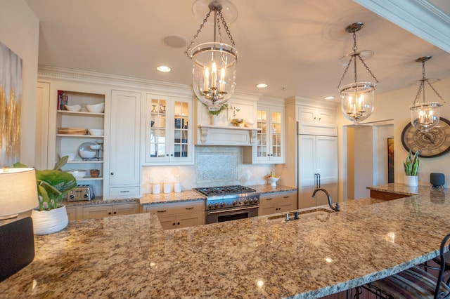 101 Harbor Greene Dr Unit W705, Bellevue, KY 41073 - kitchen with a chandelier, premium appliances, light stone countertops, a sink, and a kitchen bar