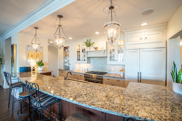 101 Harbor Greene Dr Unit W705, Bellevue, KY 41073 - kitchen featuring a sink, high quality appliances, a breakfast bar, a chandelier, and light stone countertops