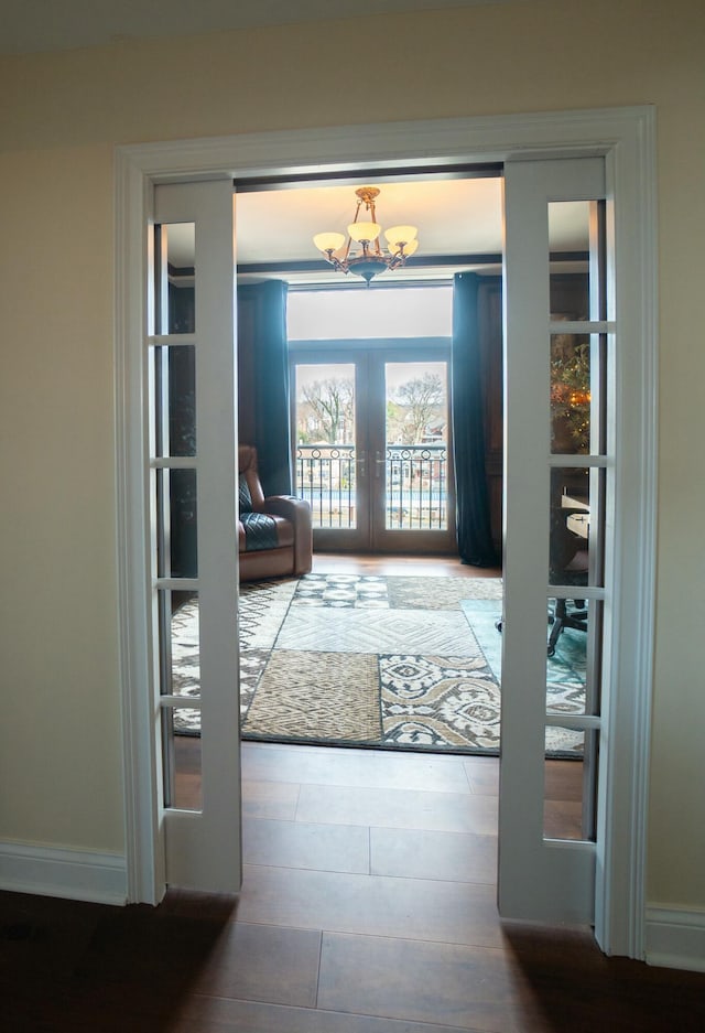 101 Harbor Greene Dr Unit W705, Bellevue, KY 41073 - doorway with french doors, baseboards, and a chandelier