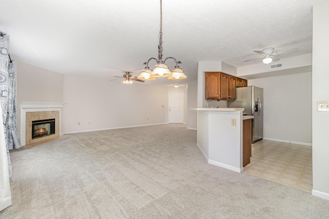 1546 Taramore Dr Unit 203, Florence, KY 41042 - kitchen with ceiling fan, brown cabinets, stainless steel fridge, and light countertops