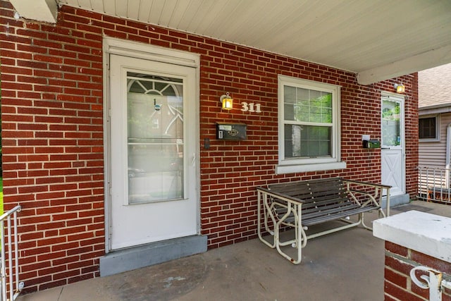 309 Hawthorne St, Covington, KY 41014 - entrance to property featuring a porch and brick siding
