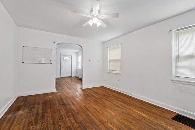 309 Hawthorne St, Covington, KY 41014 - spare room with arched walkways, a ceiling fan, wood finished floors, and baseboards