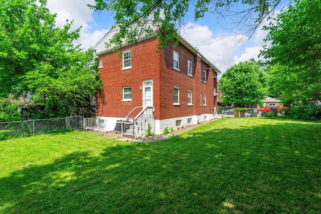 309 Hawthorne St, Covington, KY 41014 - view of property exterior featuring brick siding and central AC