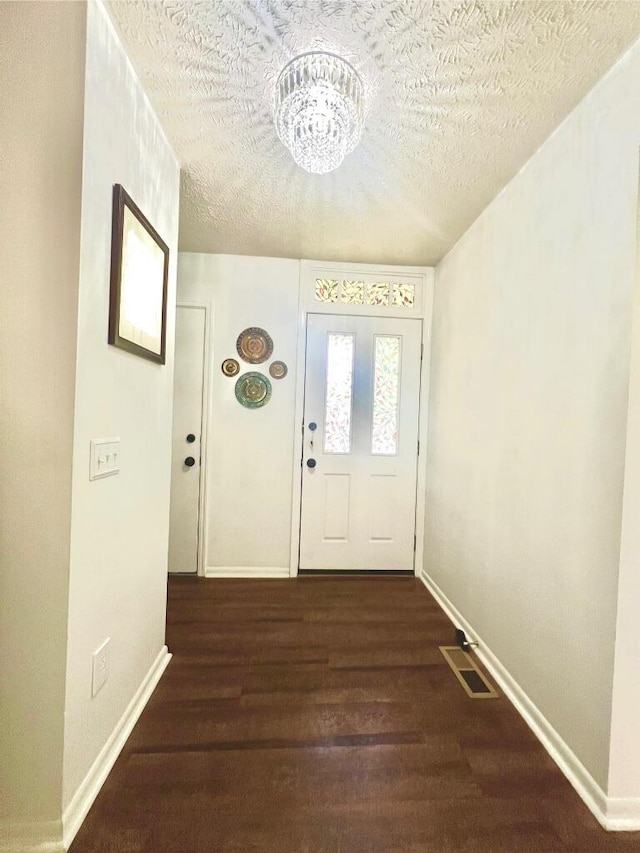 202 Shaker Heights Ln, Crestview Hills, KY 41017 - doorway to outside with wood finished floors, baseboards, and a textured ceiling