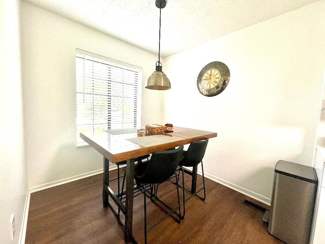 202 Shaker Heights Ln, Crestview Hills, KY 41017 - dining area featuring baseboards and dark wood-style flooring