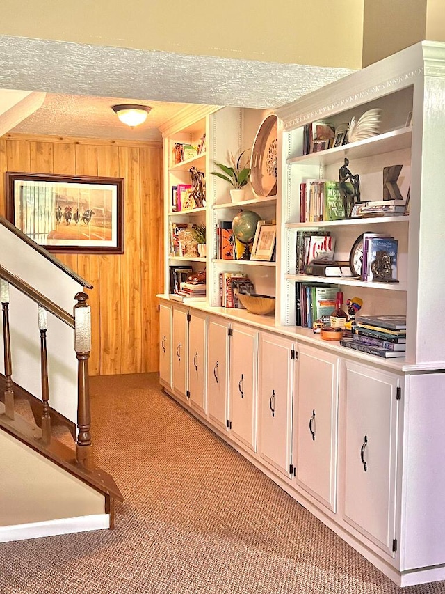 202 Shaker Heights Ln, Crestview Hills, KY 41017 - corridor featuring light carpet, wooden walls, and stairs