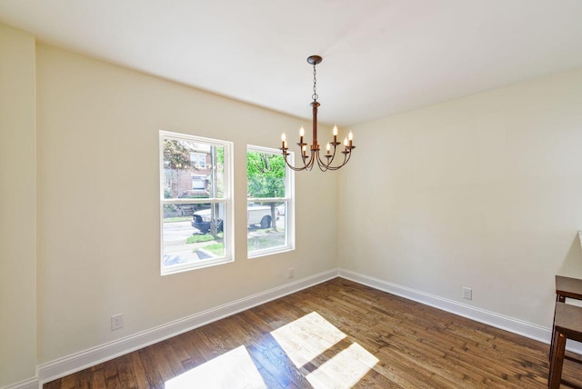 831 Linden Ave, Newport, KY 41071 - unfurnished room with a chandelier, dark wood-style floors, and baseboards
