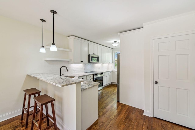 831 Linden Ave, Newport, KY 41071 - kitchen with stainless steel appliances, a sink, open shelves, a peninsula, and tasteful backsplash