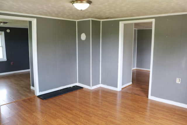 555 Breck Rd, Owenton, KY 40359 - spare room with baseboards, wood finished floors, and crown molding