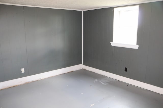 555 Breck Rd, Owenton, KY 40359 - empty room with baseboards, concrete floors, and wooden walls