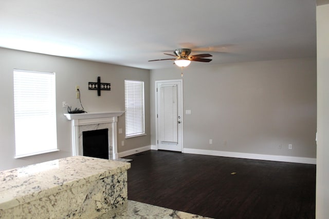 10083 Irish Way, Union, KY 41091 - unfurnished living room featuring dark wood-type flooring, a ceiling fan, a premium fireplace, and baseboards