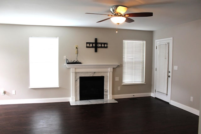 10083 Irish Way, Union, KY 41091 - unfurnished living room featuring ceiling fan, a fireplace, dark wood-type flooring, and baseboards