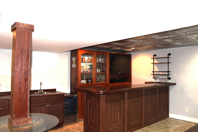10083 Irish Way, Union, KY 41091 - indoor wet bar with beverage cooler, decorative columns, and tile patterned flooring