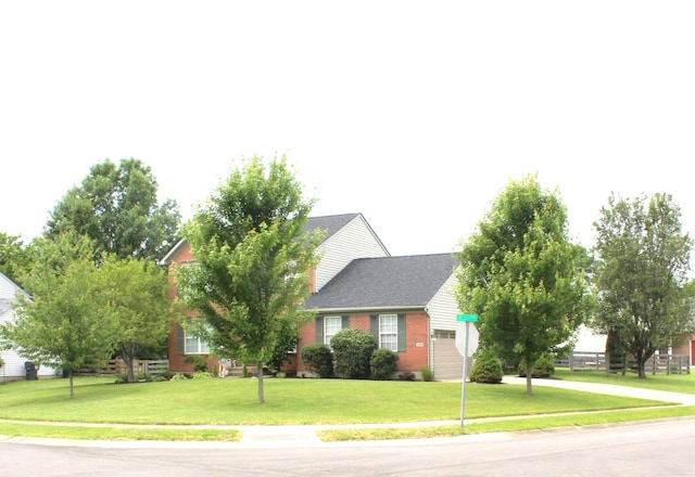 10083 Irish Way, Union, KY 41091 - view of front facade featuring an attached garage, a front lawn, driveway, and brick siding
