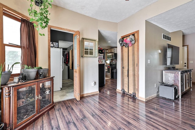 575 Stringtown Rd, Corinth, KY 41010 - corridor with a textured ceiling and wood finished floors