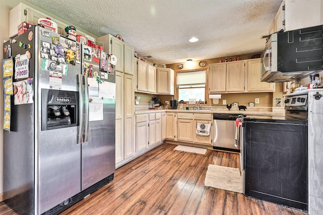 575 Stringtown Rd, Corinth, KY 41010 - kitchen featuring stainless steel appliances, light countertops, dark wood-style flooring, a textured ceiling, and recessed lighting