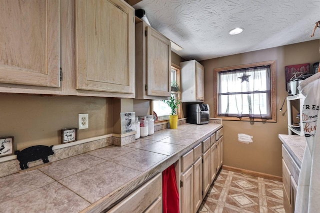 575 Stringtown Rd, Corinth, KY 41010 - kitchen featuring tile countertops, light brown cabinetry, and a textured ceiling
