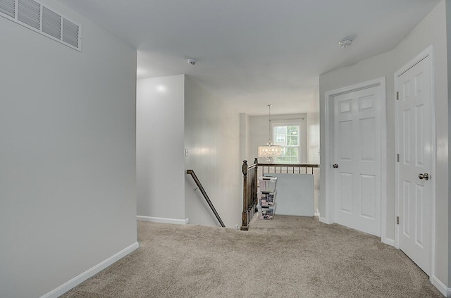 10658 Blooming Ct, Independence, KY 41051 - corridor with an upstairs landing, carpet flooring, and a chandelier