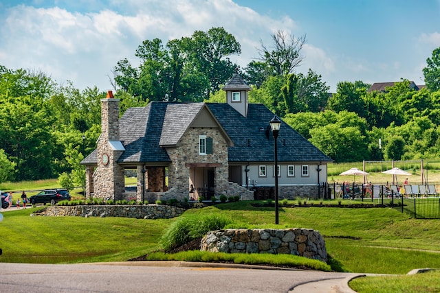 3328 Mackenzie Ct Unit 717A, Union, KY 41091 - view of front of property with stone siding, a chimney, and a high end roof