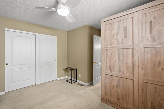 10335 Mackay Ct, Independence, KY 41051 - unfurnished bedroom featuring light colored carpet, baseboards, a closet, and a ceiling fan