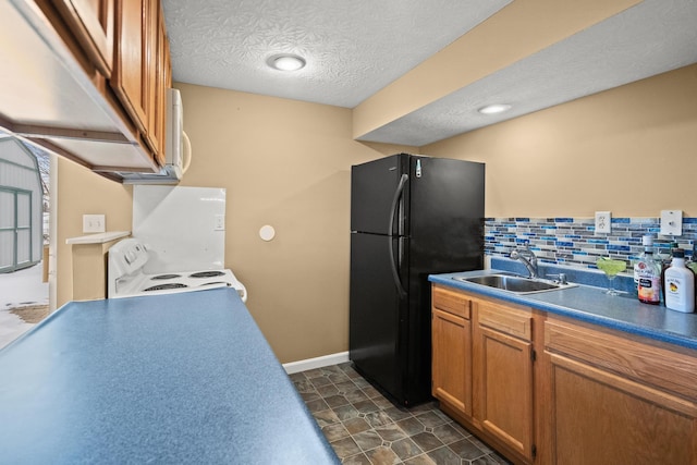 10335 Mackay Ct, Independence, KY 41051 - kitchen featuring electric range, a sink, freestanding refrigerator, brown cabinets, and tasteful backsplash
