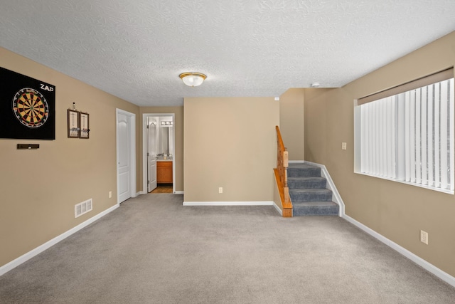 10335 Mackay Ct, Independence, KY 41051 - carpeted empty room featuring stairs, baseboards, and a textured ceiling