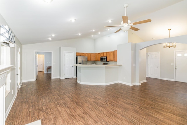 1285 Edinburgh Ln, Union, KY 41091 - unfurnished living room featuring arched walkways, ceiling fan, dark wood-type flooring, a chandelier, and high vaulted ceiling