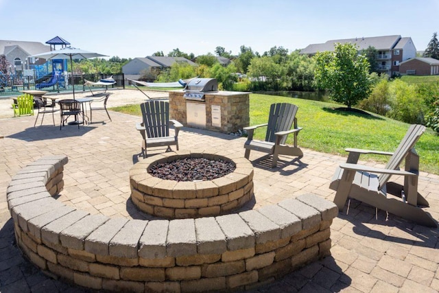 701 Napa Valley Ln Unit 9, Crestview Hills, KY 41017 - view of patio featuring a fire pit, area for grilling, and a playground