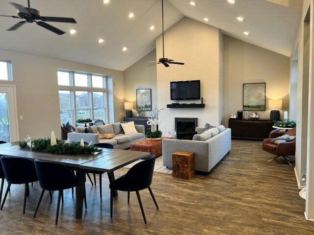 701 Napa Valley Ln Unit 9, Crestview Hills, KY 41017 - dining space featuring ceiling fan, high vaulted ceiling, recessed lighting, dark wood-style flooring, and a fireplace