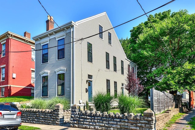 410 Emma St, Covington, KY 41011 - view of front facade with a chimney
